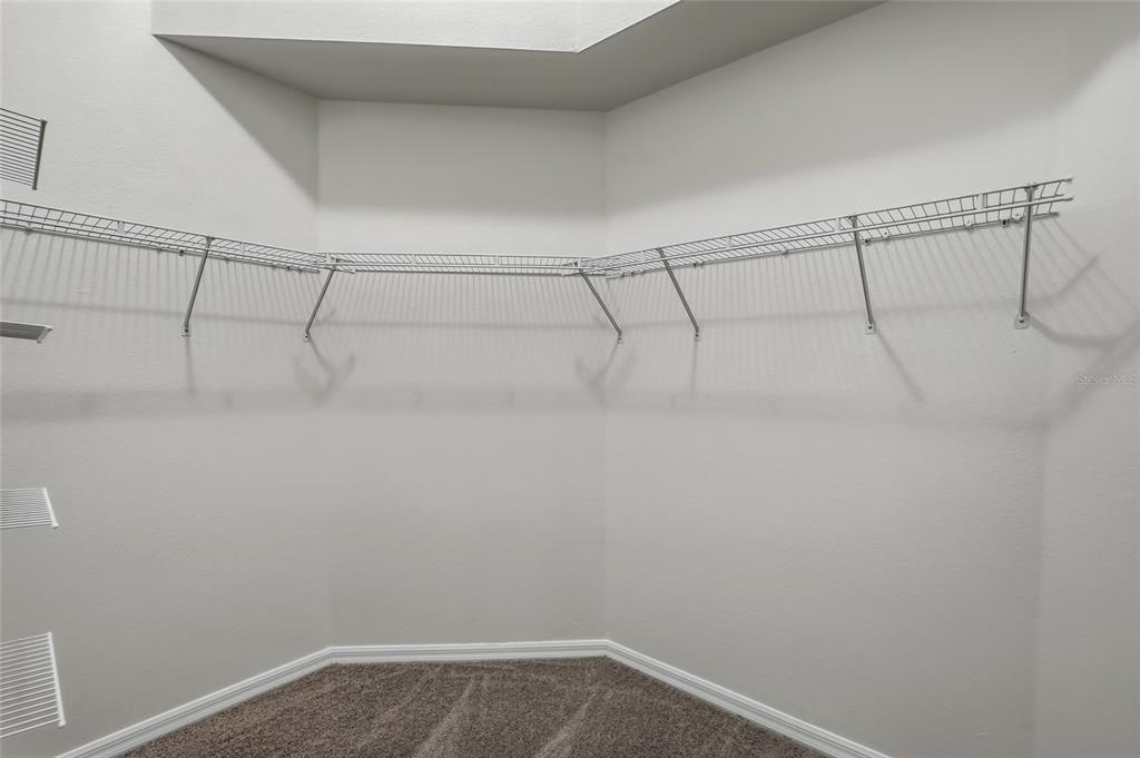 6935 Freeport Road Riverview, FL 33578 - Photo 32 of 51 a view of a room with racks on the wall