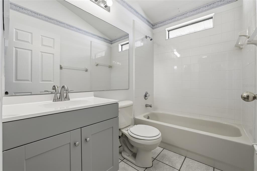 6935 Freeport Road Riverview, FL 33578 - Photo 35 of 51 a bathroom with a sink a toilet and shower
