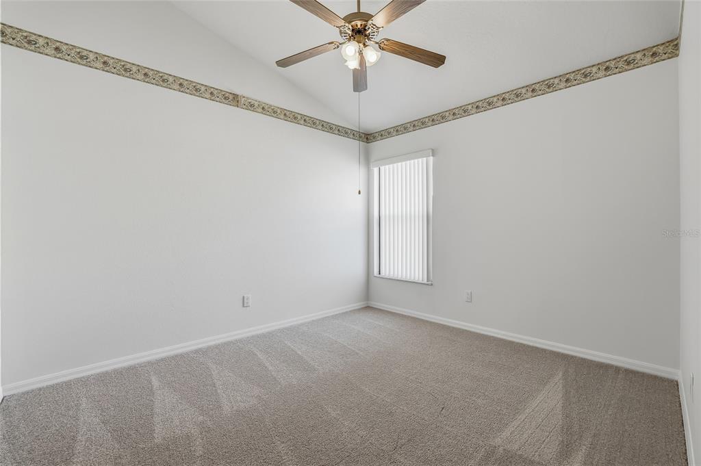 6935 Freeport Road Riverview, FL 33578 - Photo 36 of 51 a view of a chandelier fan in a room