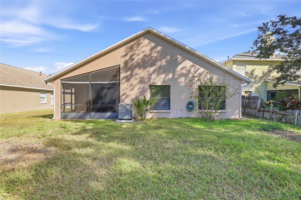 6935 Freeport Road Riverview, FL 33578 - Photo 43 of 51 a view of a house with backyard and a garden
