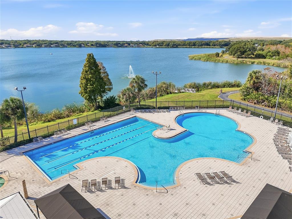 6935 Freeport Road Riverview, FL 33578 - Photo 47 of 51 a view of a lake with a table and chairs in wooden floor