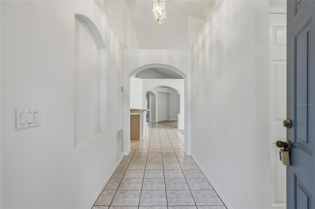 6935 Freeport Road Riverview, FL 33578 - Photo 6 of 51 a view of a hallway with a white walls