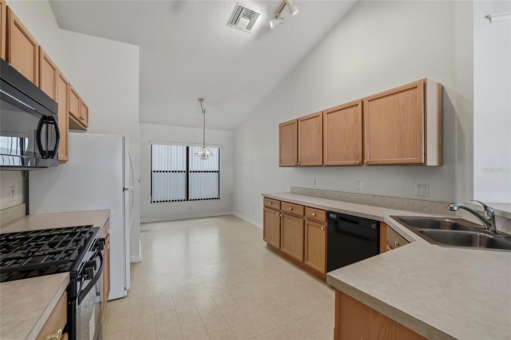 6935 Freeport Road Riverview, FL 33578 - Photo 9 of 51 a kitchen that has a sink and a stove