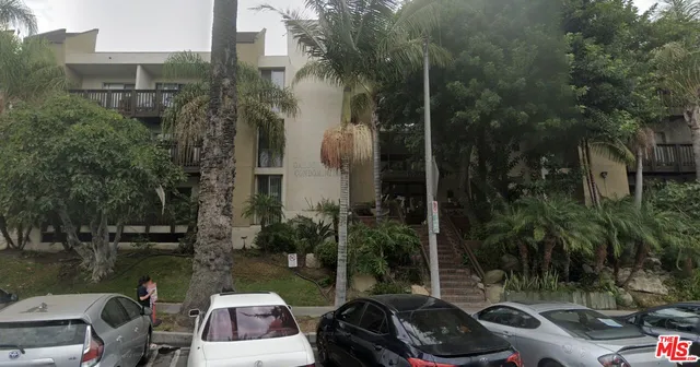 a view of a lake with couches and city view