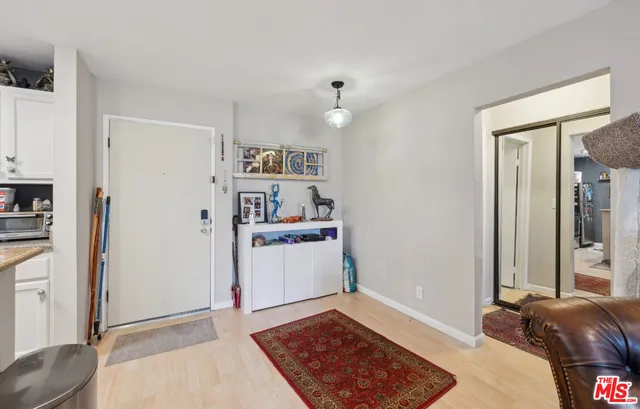 a view of a bedroom with bed and closet