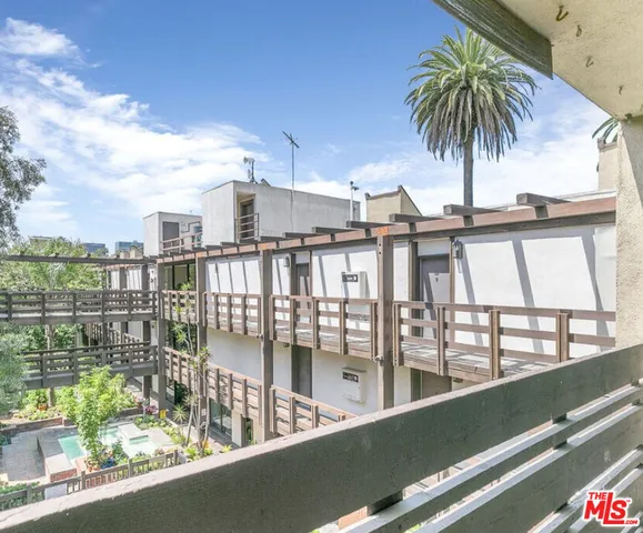 a view of a swimming pool with a deck