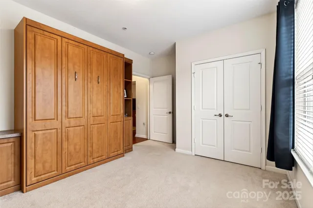 a view of a closet area with natural light