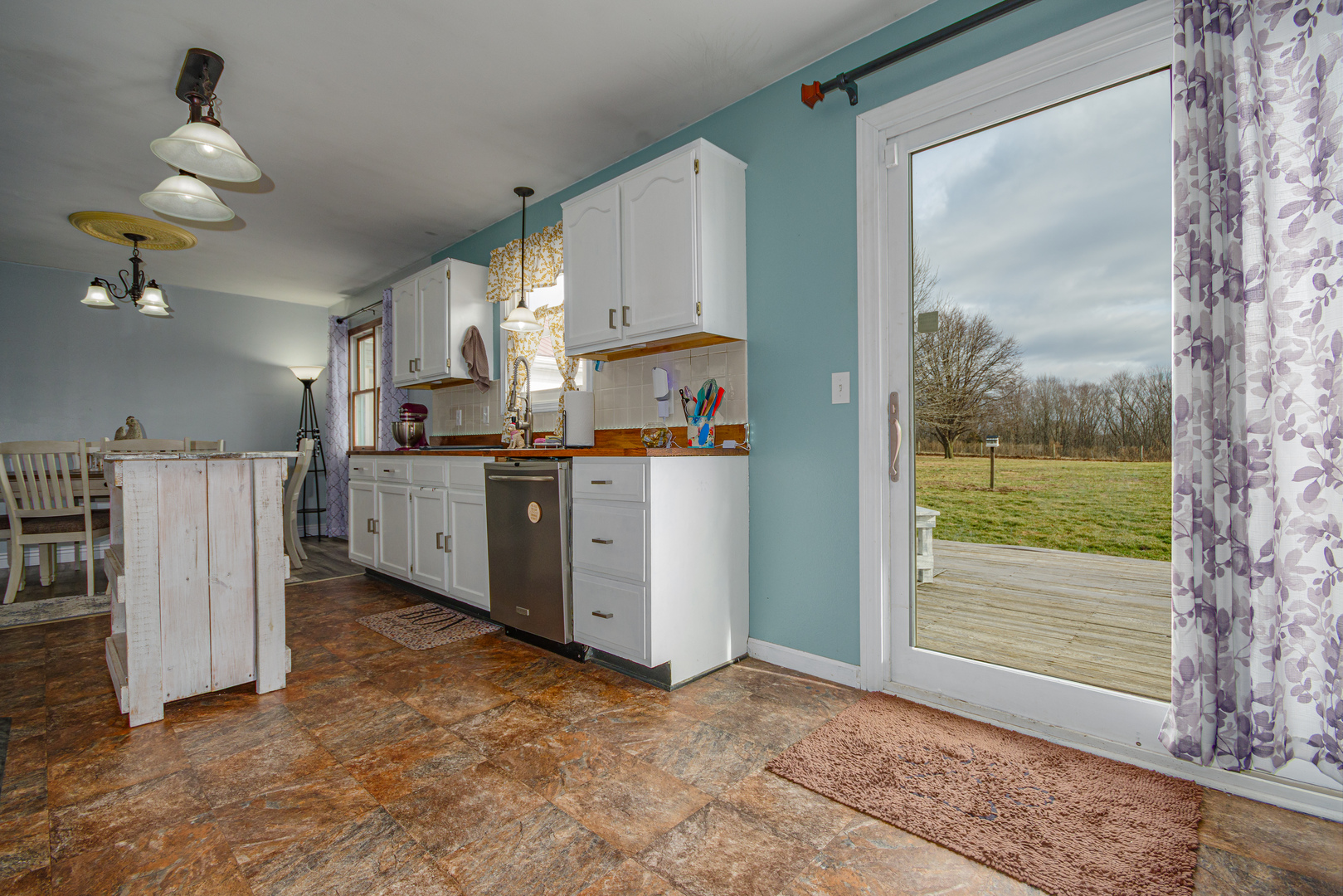 4786 Keller Road Iuka, IL 62849 - Photo 12 of 40 a view of a kitchen with a sink and dishwasher with white walls