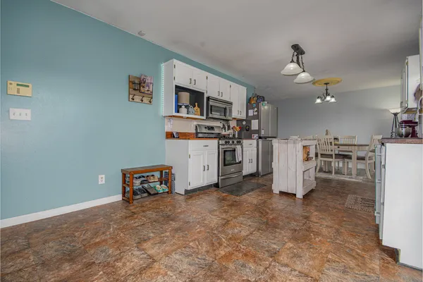 a living room with furniture and a rug