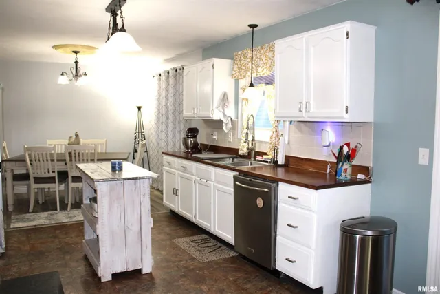 a kitchen with a stove and a microwave