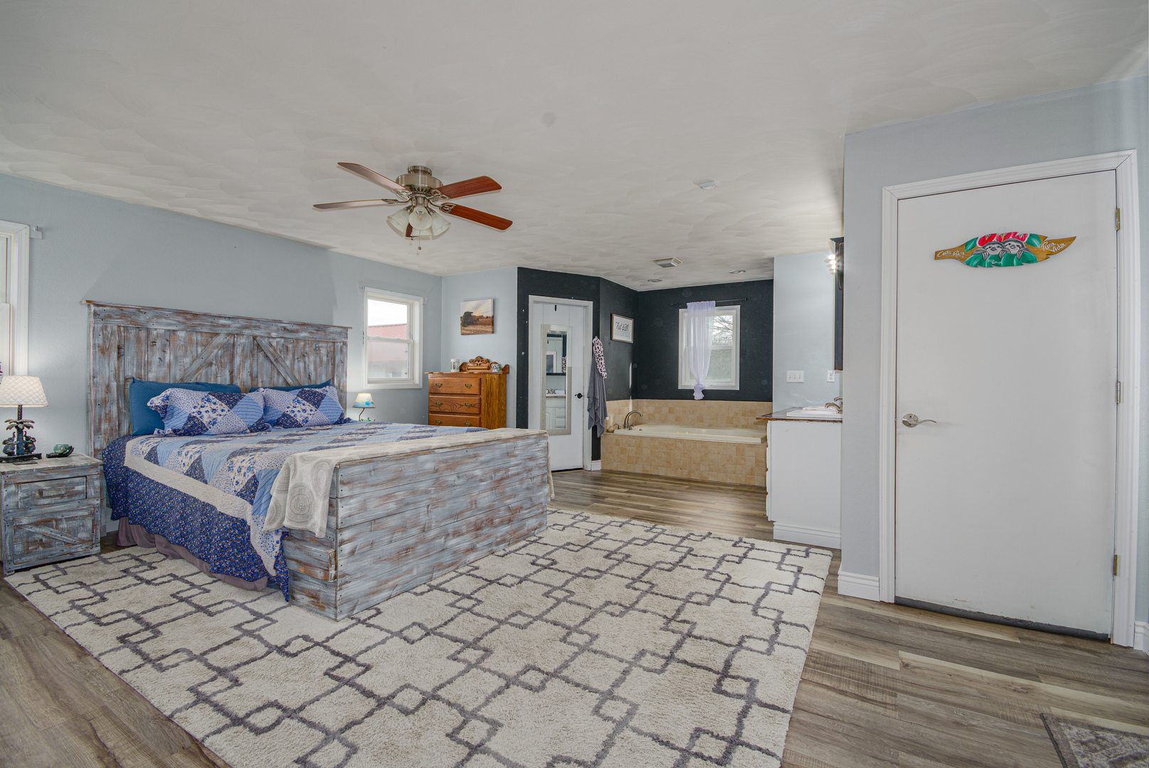 4786 Keller Road Iuka, IL 62849 - Photo 23 of 40 a bedroom with a large bed and a chandelier