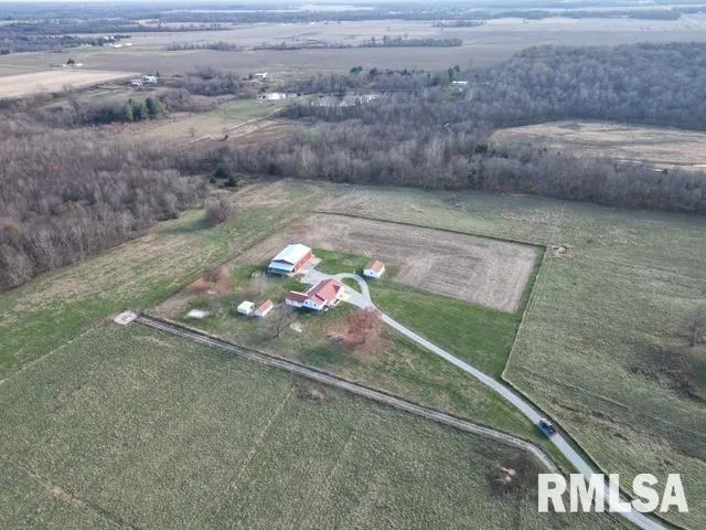 an aerial view of a house with outdoor space