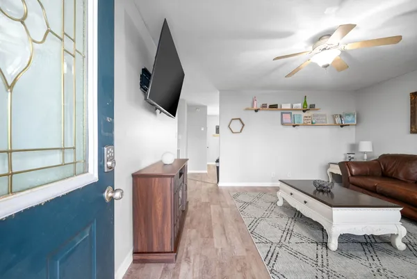 a living room with furniture and a flat screen tv