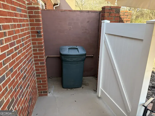 a kitchen with a stove and white cabinets