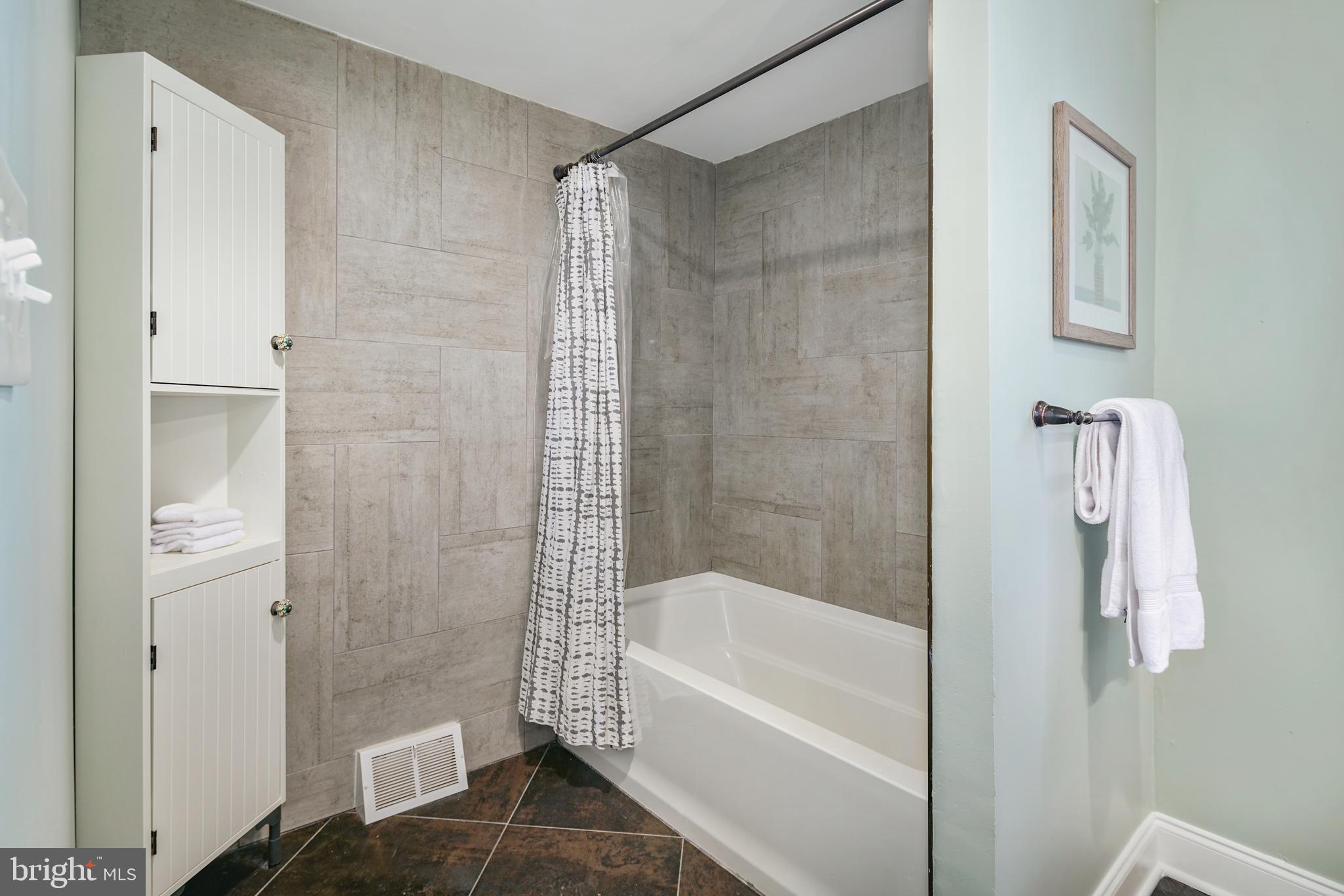 1443 East Oxford Street Philadelphia, PA 19125 - Photo 12 of 28 a bathroom with a bathtub and a shower