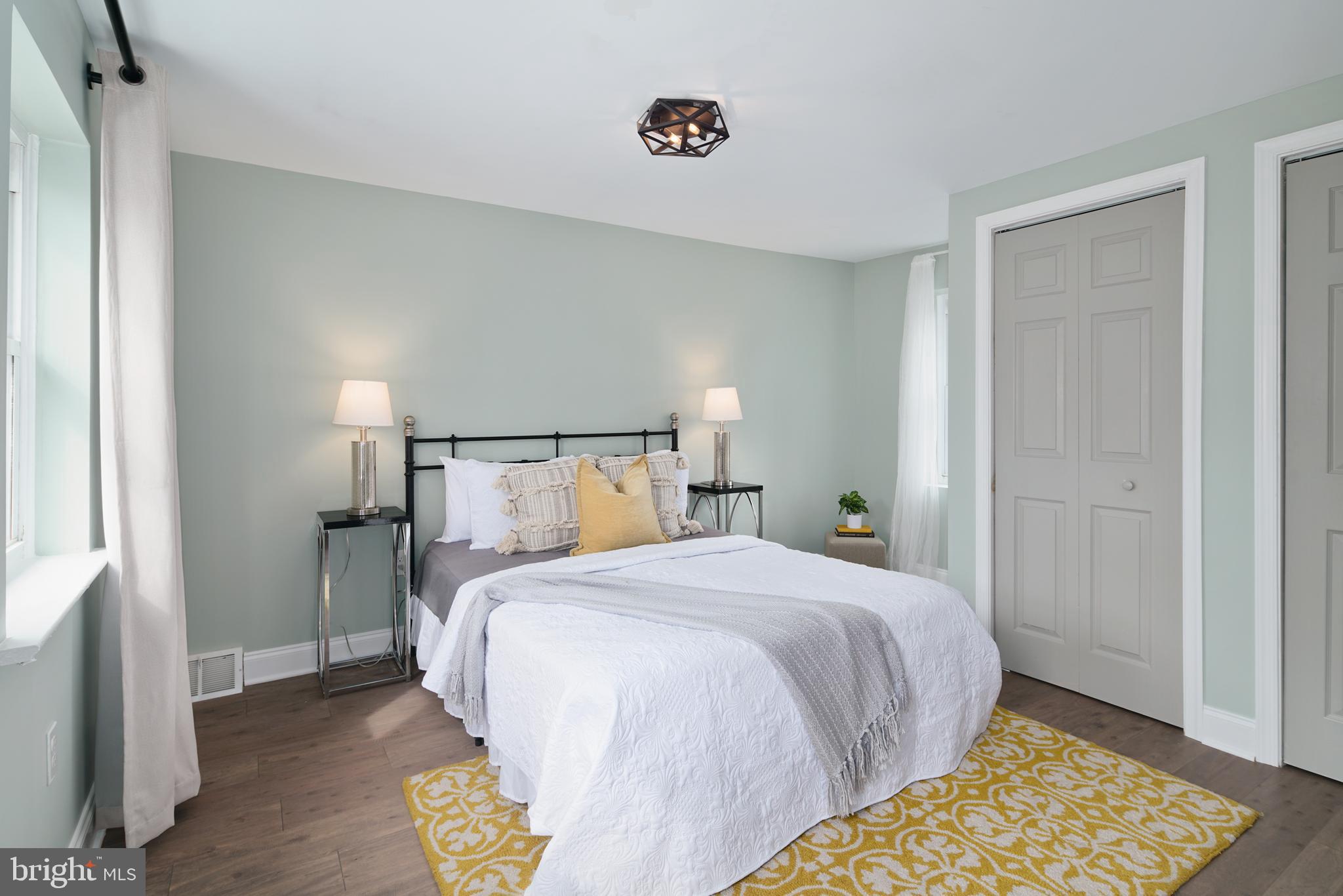 1443 East Oxford Street Philadelphia, PA 19125 - Photo 19 of 28 a bedroom with a bed and wooden floor