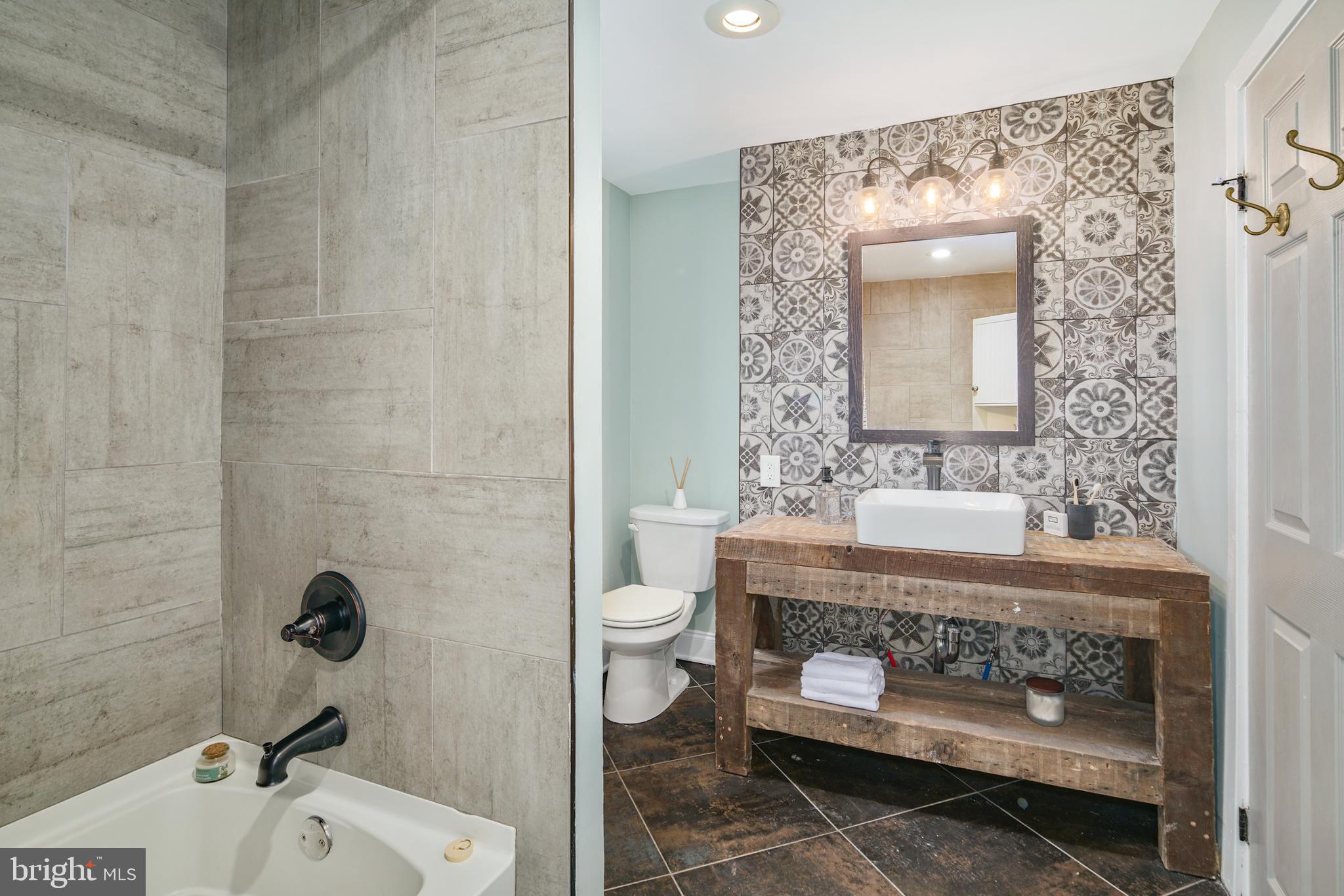 1443 East Oxford Street Philadelphia, PA 19125 - Photo 10 of 28 a bathroom with a sink toilet and mirror