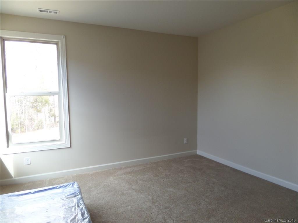 1434 Cilantro Court Tega Cay, SC 29708 - Photo 22 of 27 an empty room with a window