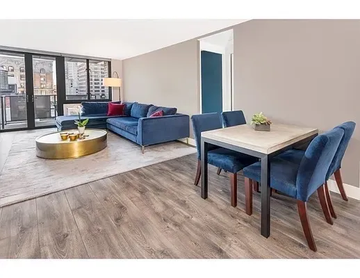 a living room with furniture and a table