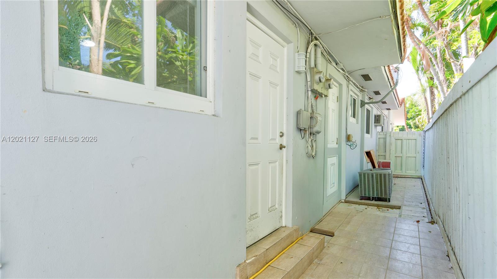 3611 Southwest 23rd Street Miami, FL 33145 - Photo 38 of 56 3611 side gate with access from kitchen and laundry room