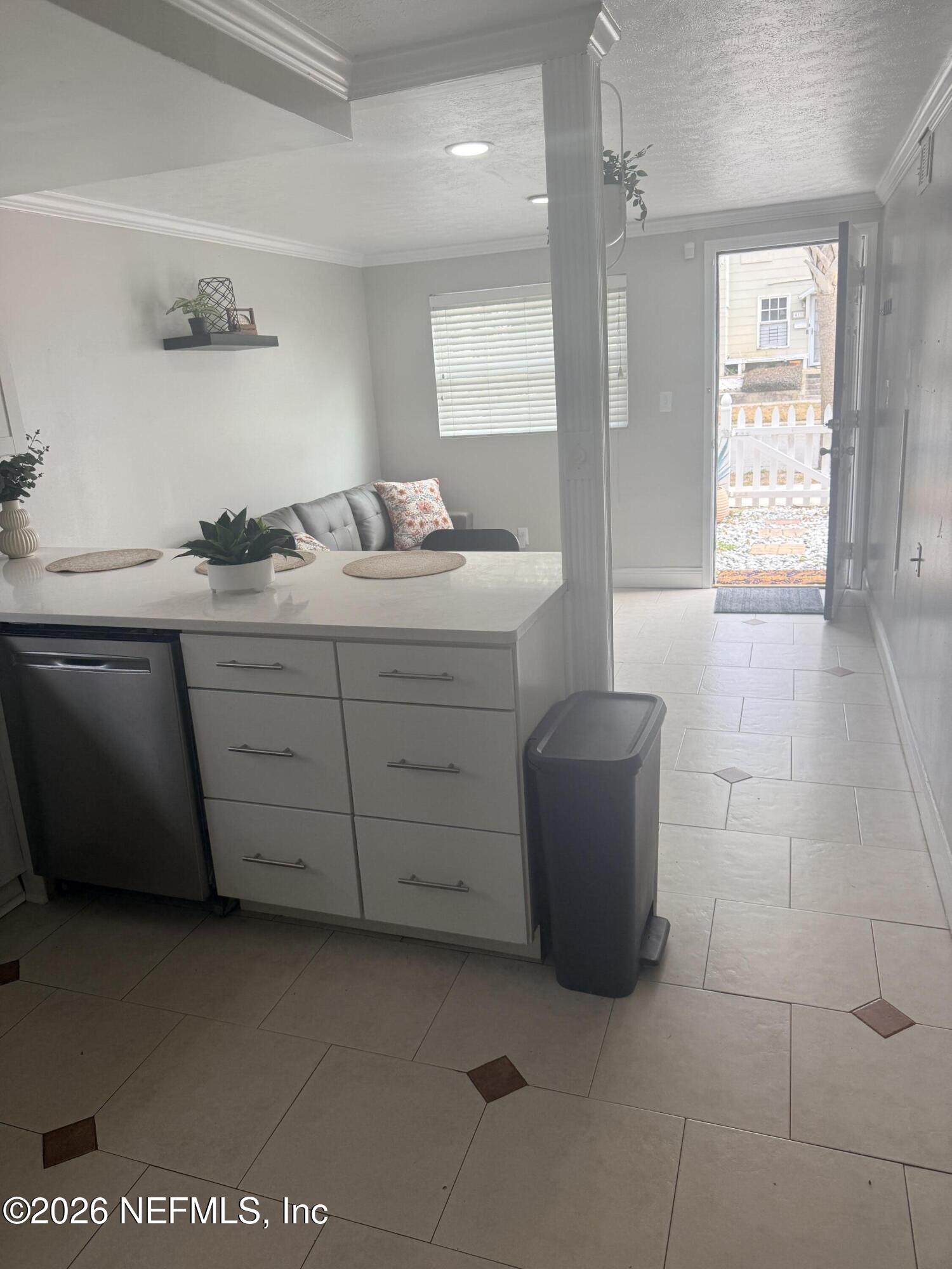 200 Walnut Street, Unit 1 Neptune Beach, FL 32266 - Photo 4 of 12 a bathroom with a sink a vanity and mirror