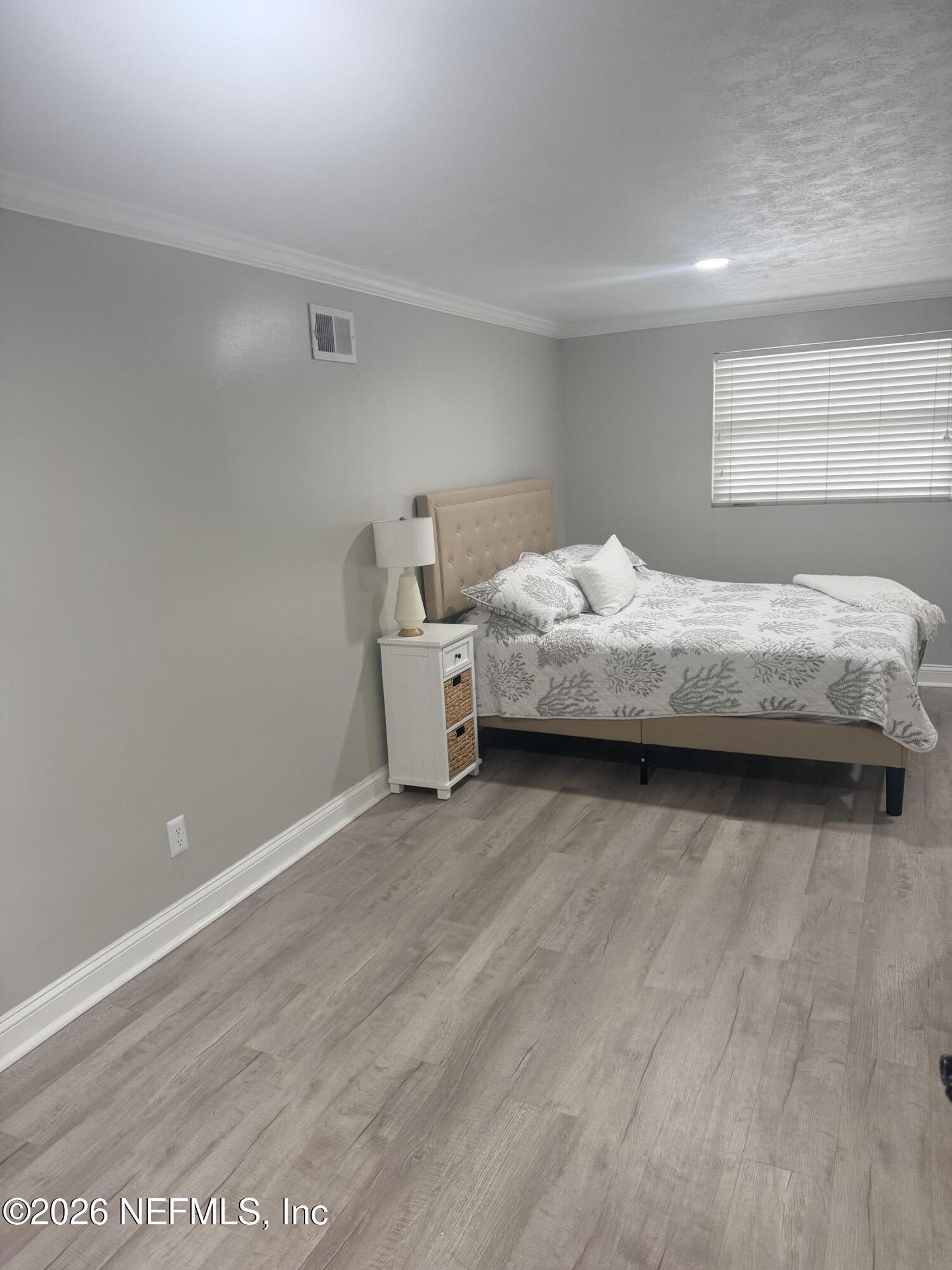 200 Walnut Street, Unit 1 Neptune Beach, FL 32266 - Photo 6 of 12 a bedroom with a bed and window