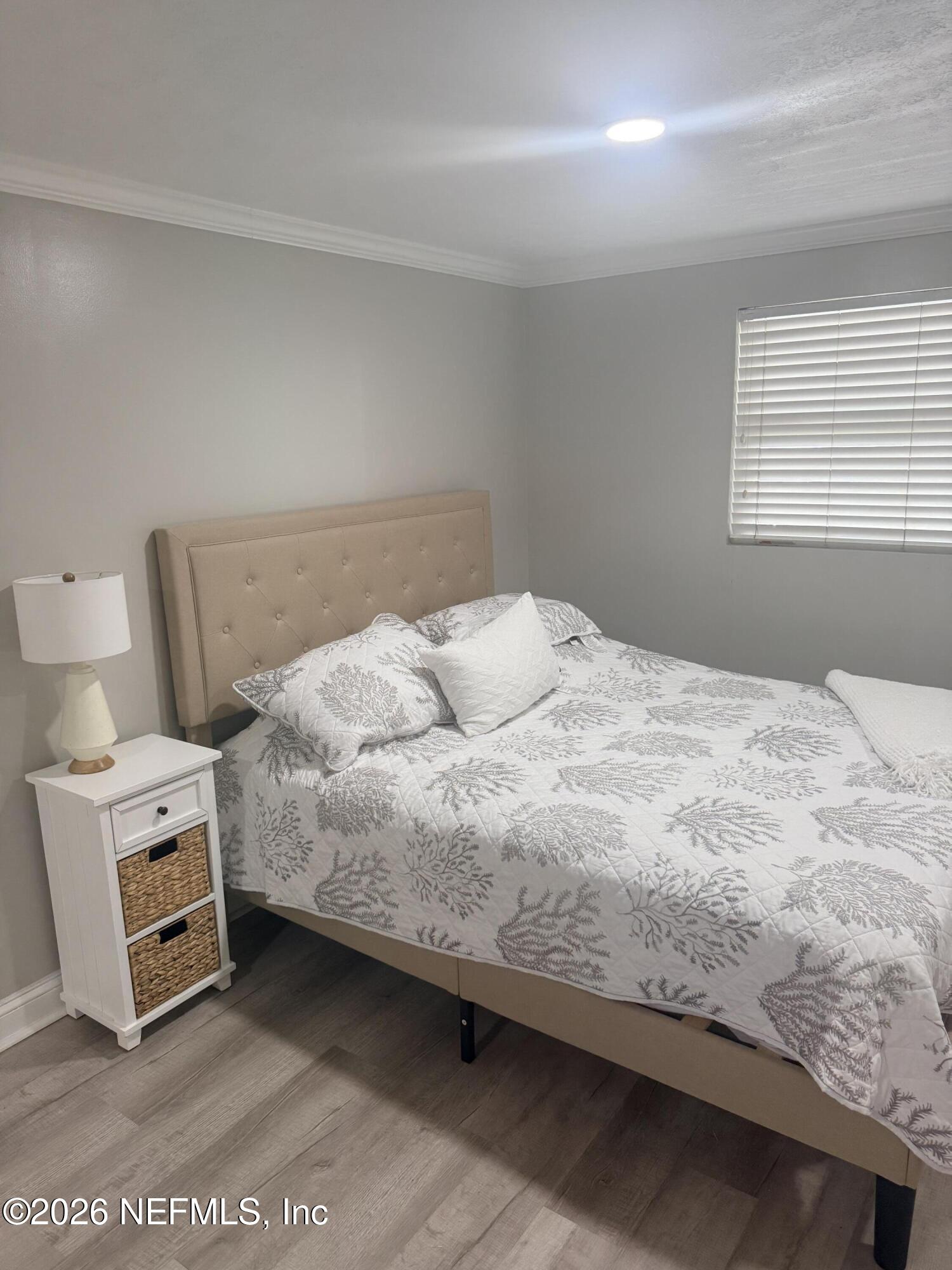 200 Walnut Street, Unit 1 Neptune Beach, FL 32266 - Photo 8 of 12 a bedroom with a bed and a window