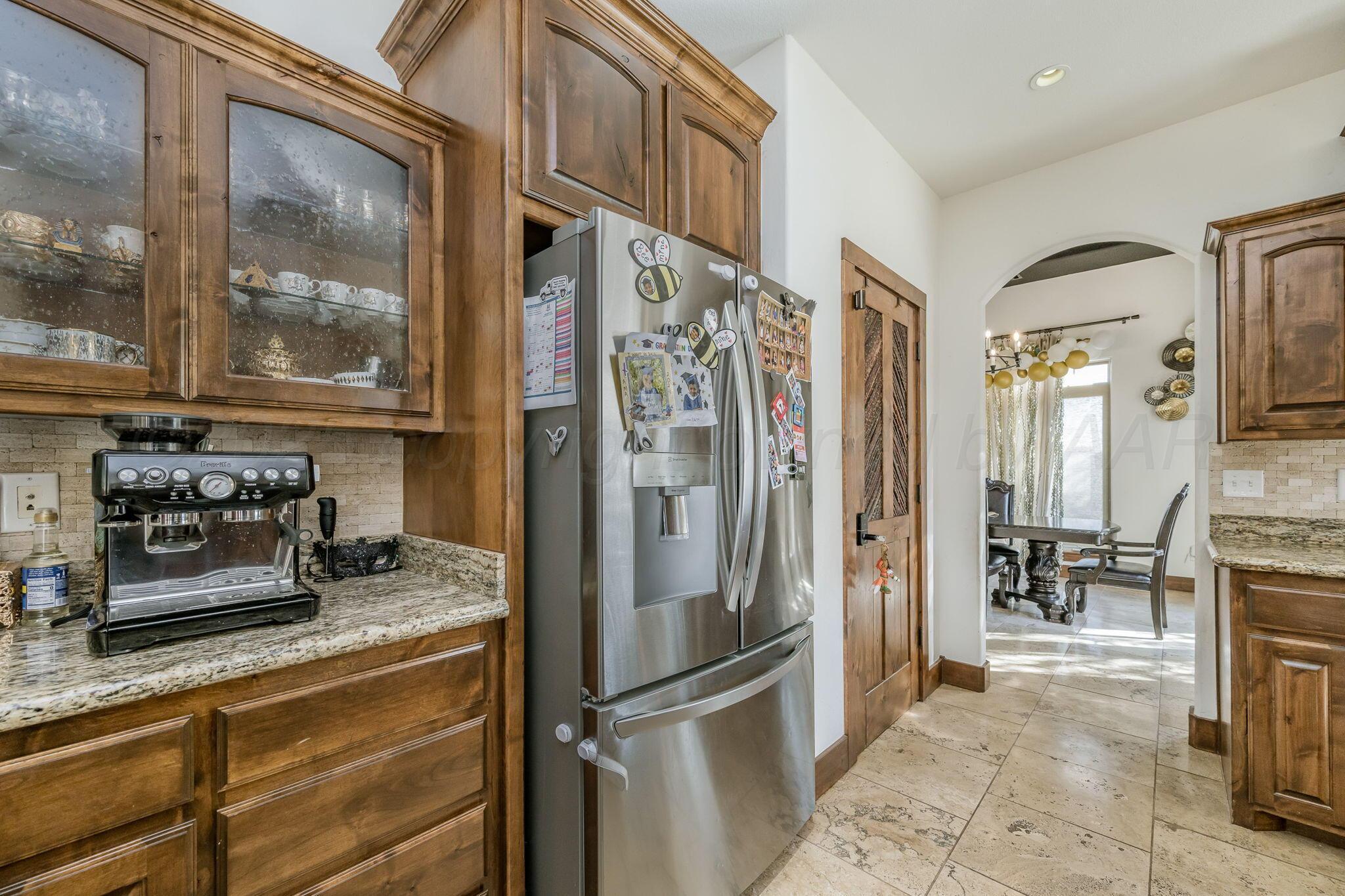 101 Pheasant Run Canyon, TX 79015 - Photo 14 of 39 a kitchen with stainless steel appliances granite countertop a refrigerator and a stove