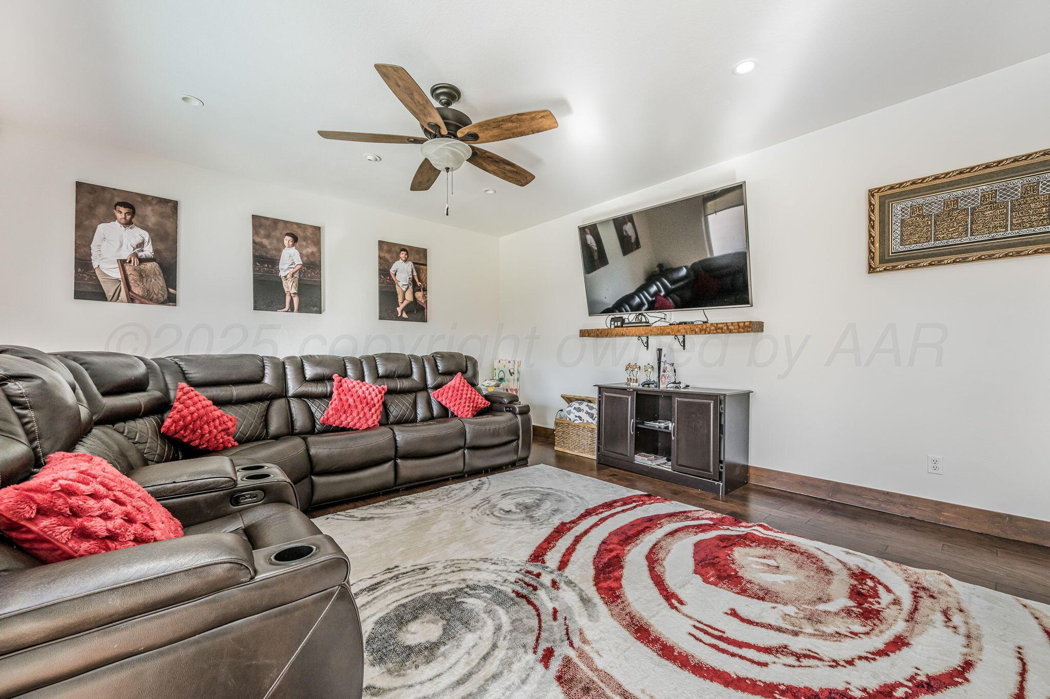 101 Pheasant Run Canyon, TX 79015 - Photo 15 of 39 a living room with furniture and a flat screen tv