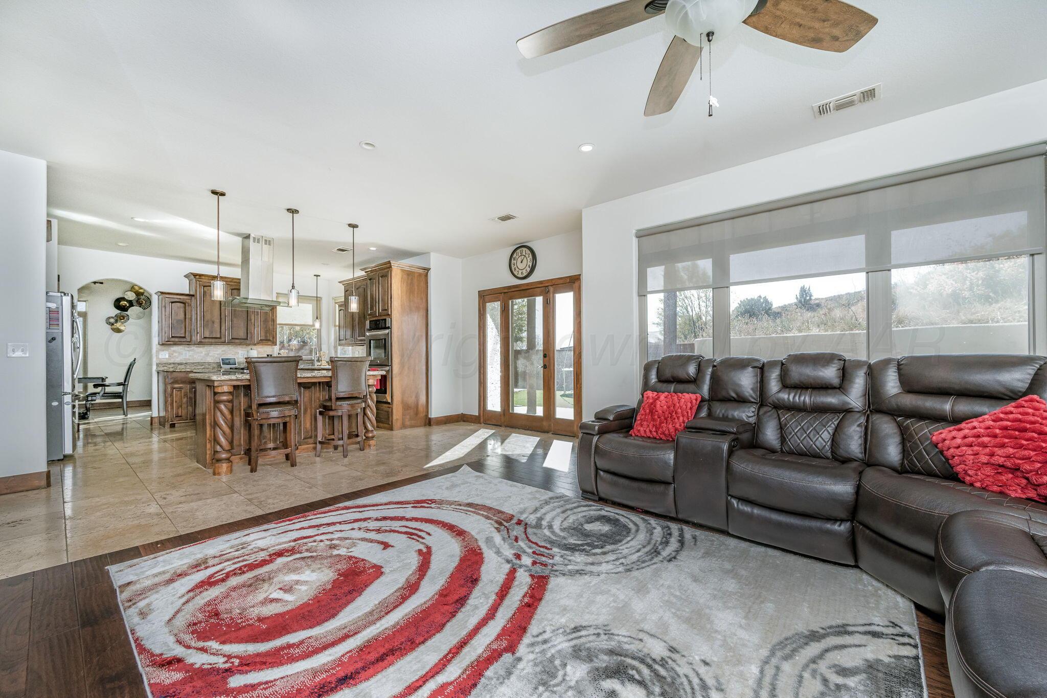 101 Pheasant Run Canyon, TX 79015 - Photo 16 of 39 a living room with furniture and a large window