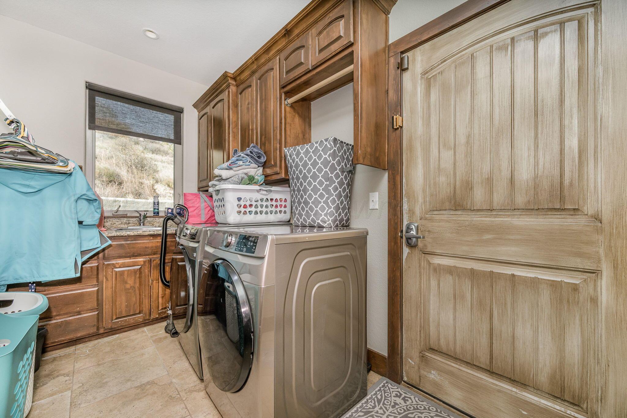 101 Pheasant Run Canyon, TX 79015 - Photo 18 of 39 a utility room with dryer and washer