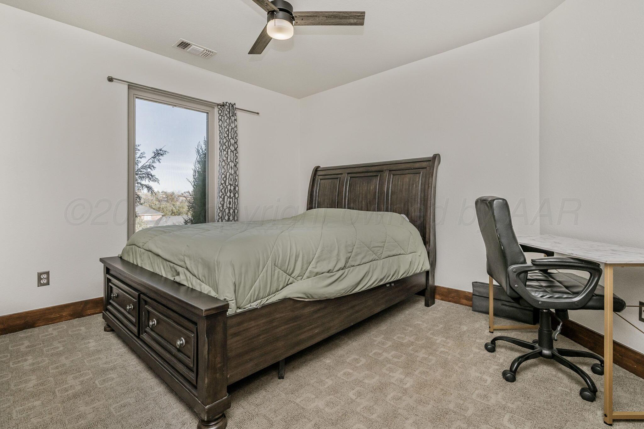 101 Pheasant Run Canyon, TX 79015 - Photo 22 of 39 a bedroom with a bed chair and window
