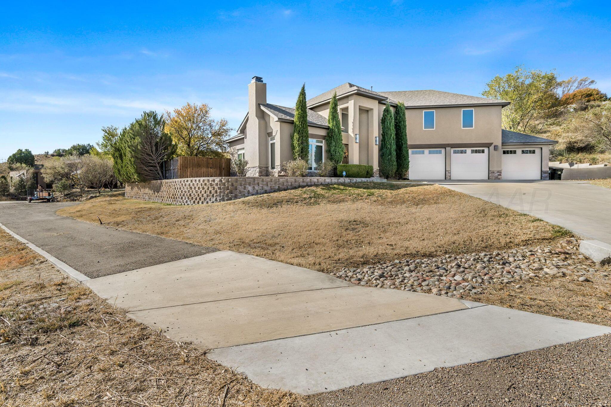 101 Pheasant Run Canyon, TX 79015 - Photo 3 of 39 a front view of a house with a yard and garage