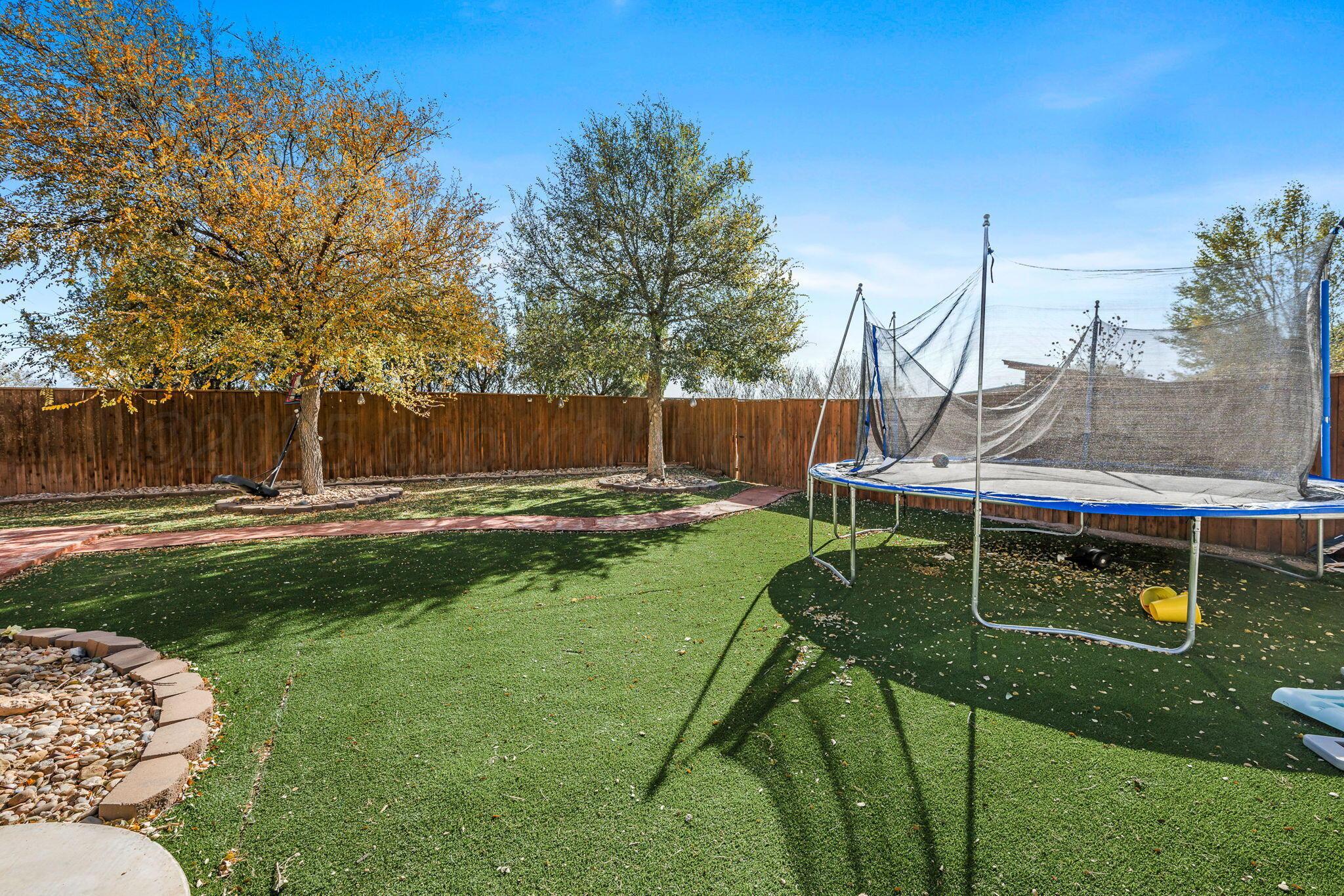 101 Pheasant Run Canyon, TX 79015 - Photo 4 of 39 a backyard of a house with table and chairs