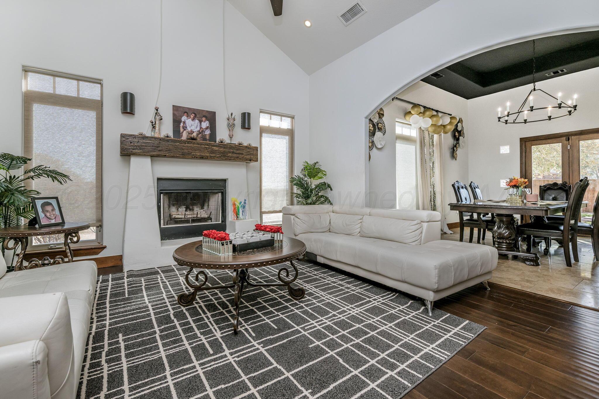 101 Pheasant Run Canyon, TX 79015 - Photo 8 of 39 a living room with furniture a rug and a fireplace