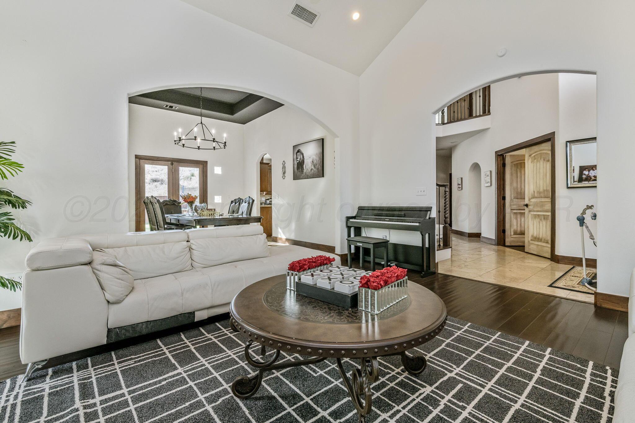 101 Pheasant Run Canyon, TX 79015 - Photo 9 of 39 a living room with furniture and a fireplace