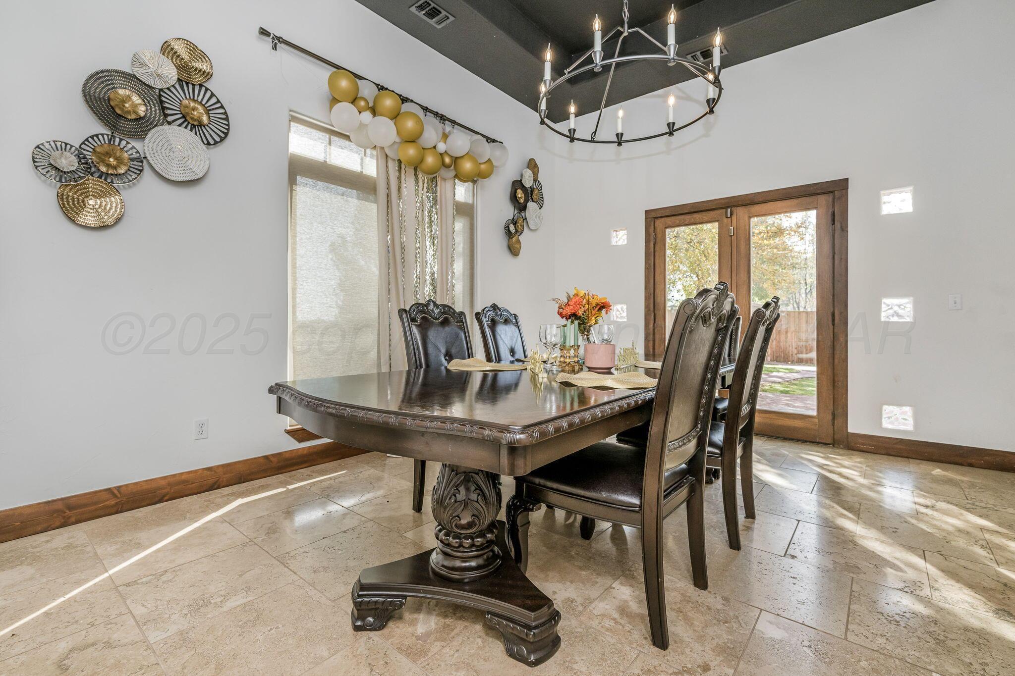 101 Pheasant Run Canyon, TX 79015 - Photo 10 of 39 a view of a dining room with furniture and window