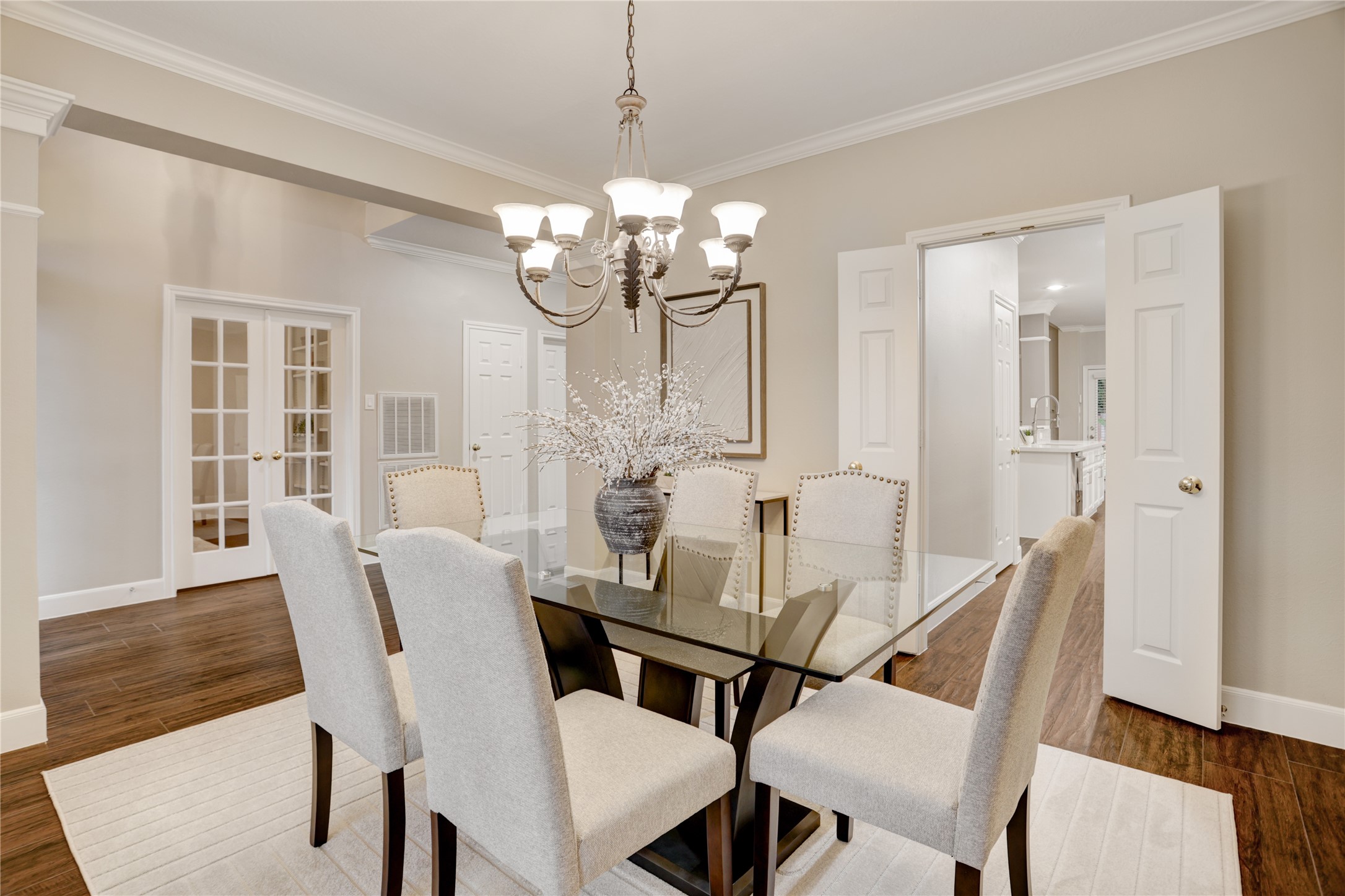 24418 Falcon Point Drive Katy, TX 77494 - Photo 5 of 40 a view of a dining room with furniture a chandelier and wooden floor