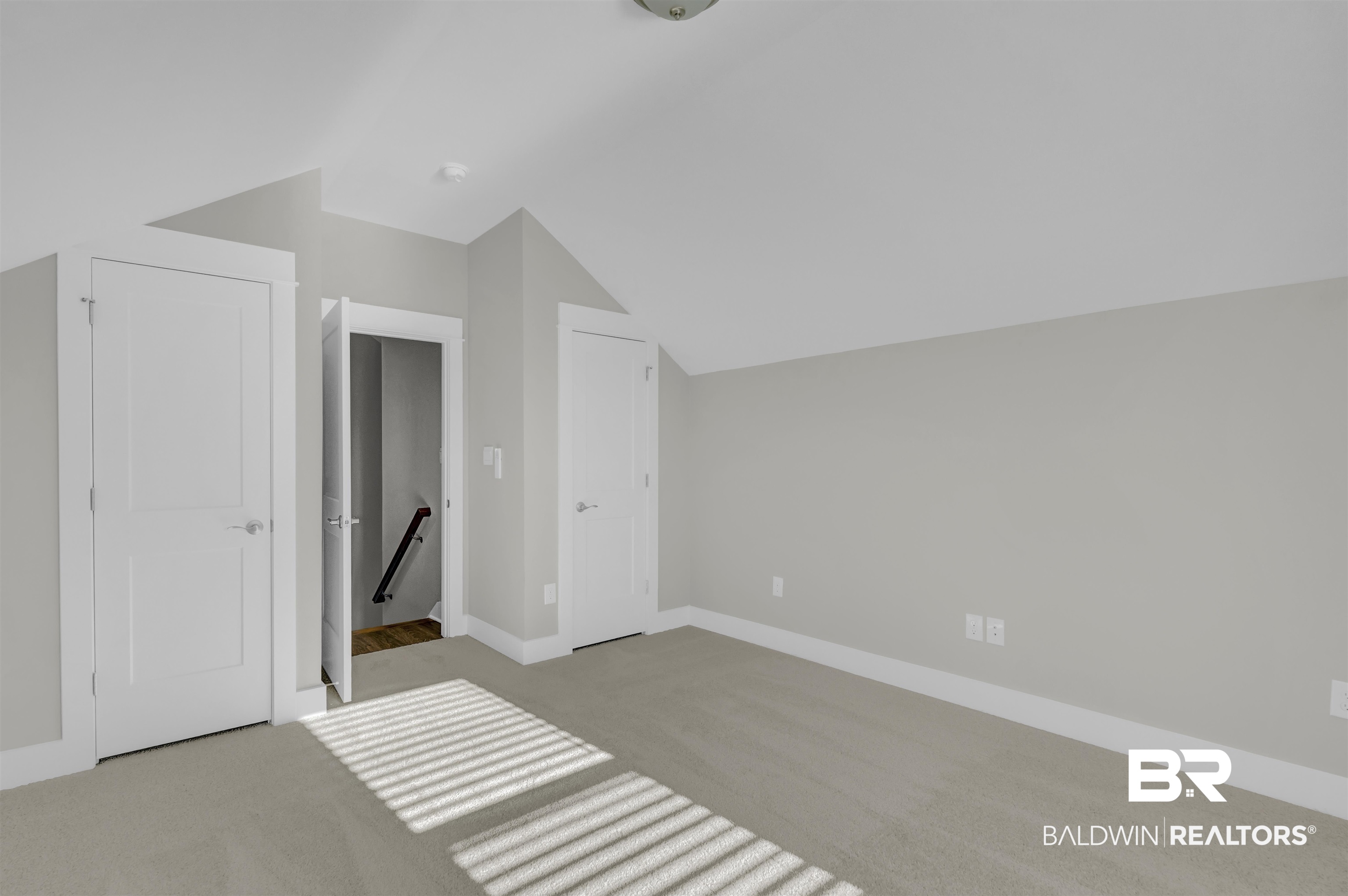 571 Morning Mist Way Fairhope, AL 36532 - Photo 35 of 47 Additional living space featuring light colored carpet and vaulted ceiling