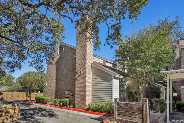 a view of empty room with a fireplace
