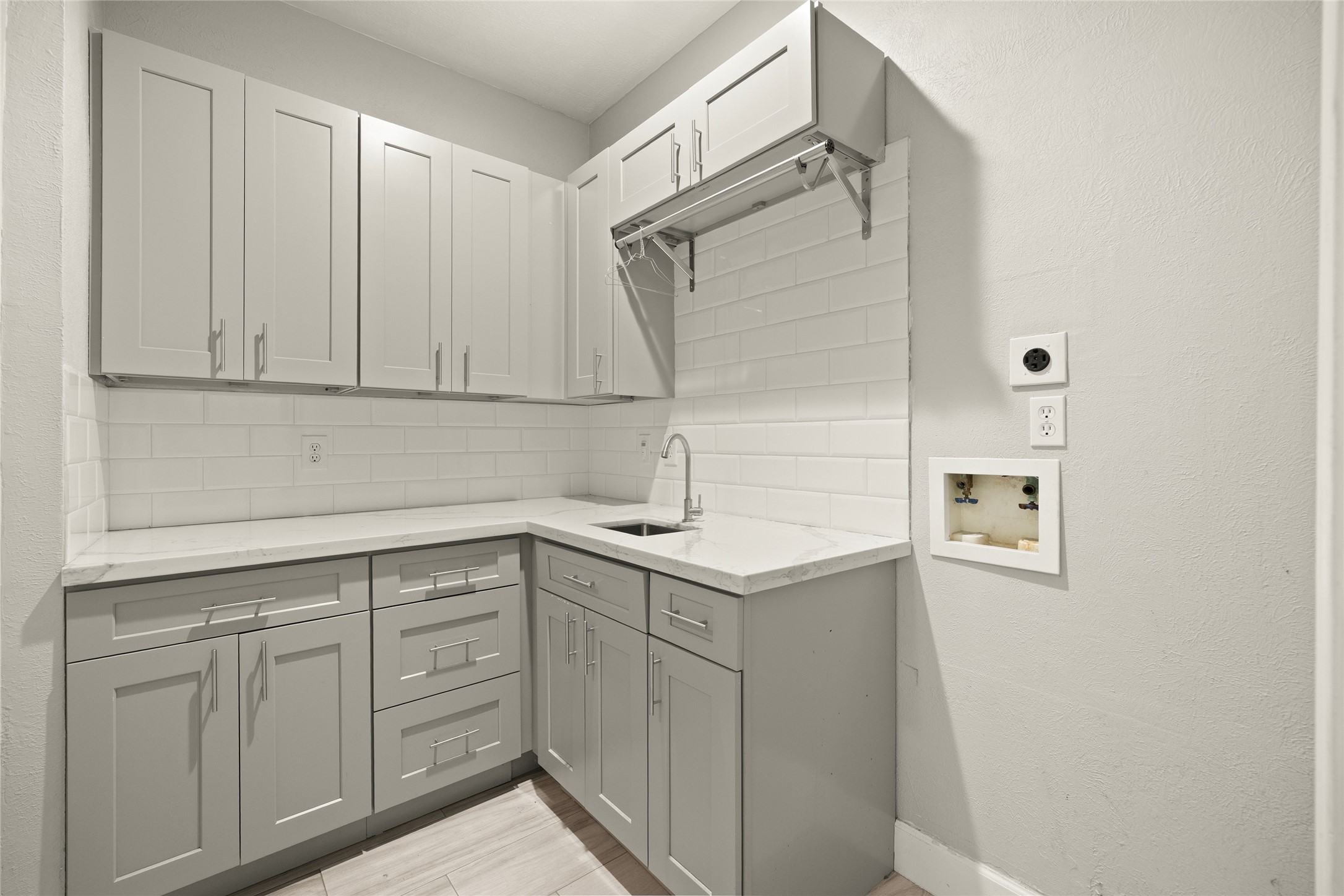 6239 Agassi Ace Court Spring, TX 77379 - Photo 10 of 19 Laundry room with lovely built in cabinetry for extra storage and supplies