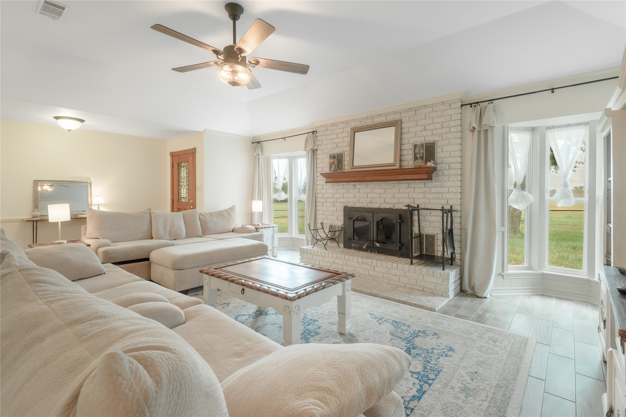 758 Wire Road Huntsville, TX 77320 - Photo 11 of 44 a living room with couches and a fireplace