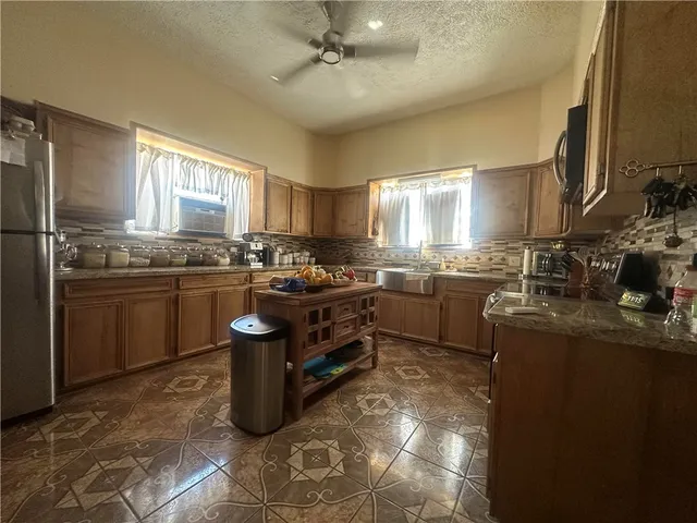 a kitchen with granite countertop lots of counter top space