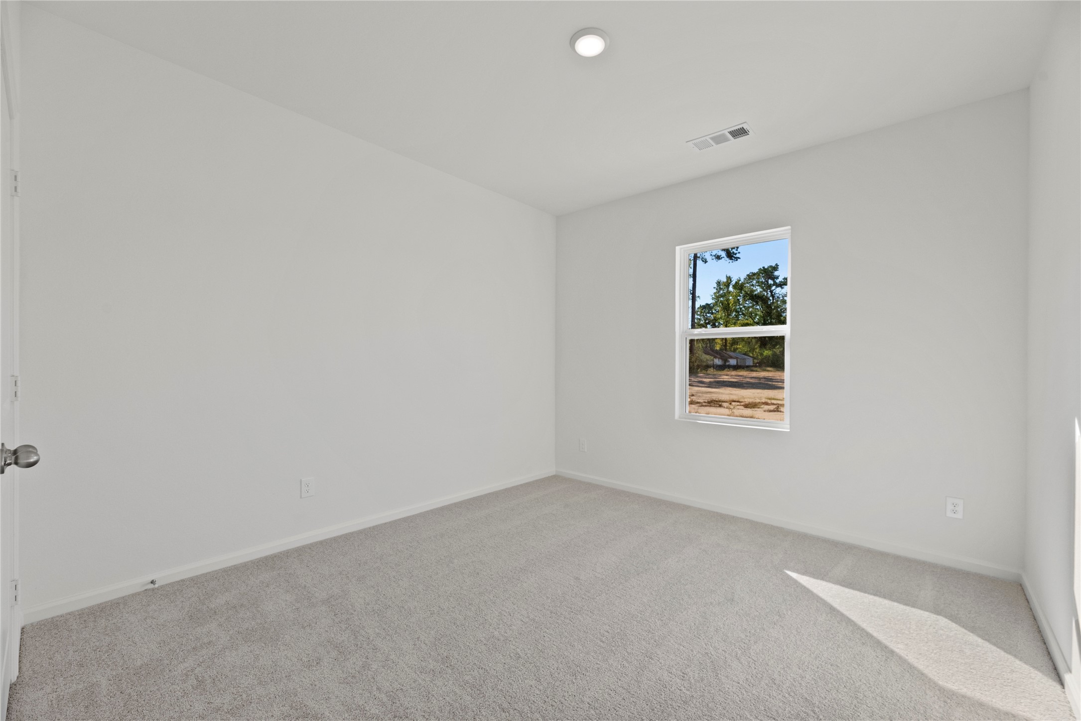 18829 Lucas Michael Way New Caney, TX 77357 - Photo 11 of 40 a view of an empty room with a window