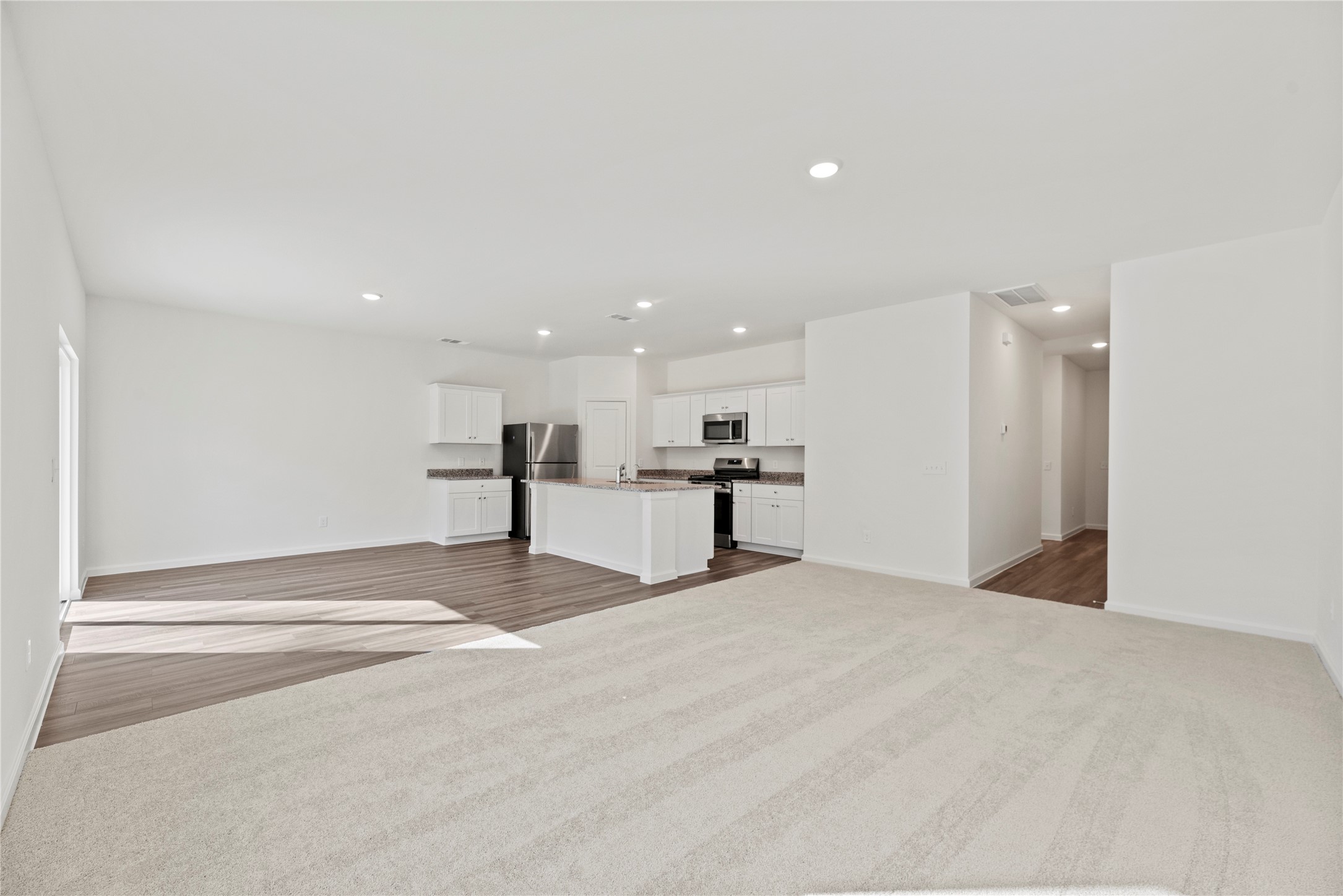18829 Lucas Michael Way New Caney, TX 77357 - Photo 15 of 40 a view of kitchen with a refrigerator and a window