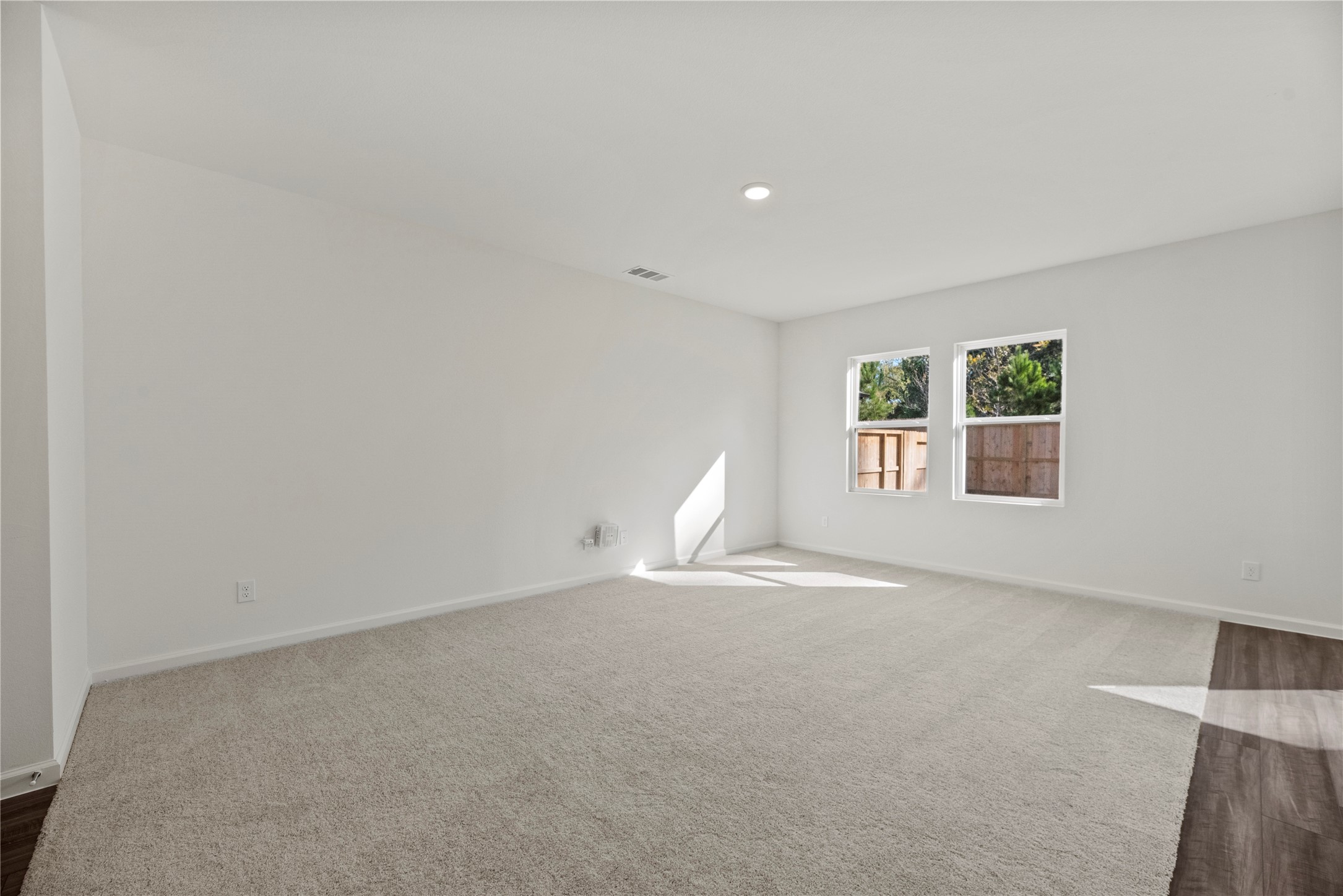 18829 Lucas Michael Way New Caney, TX 77357 - Photo 16 of 40 an empty room with windows