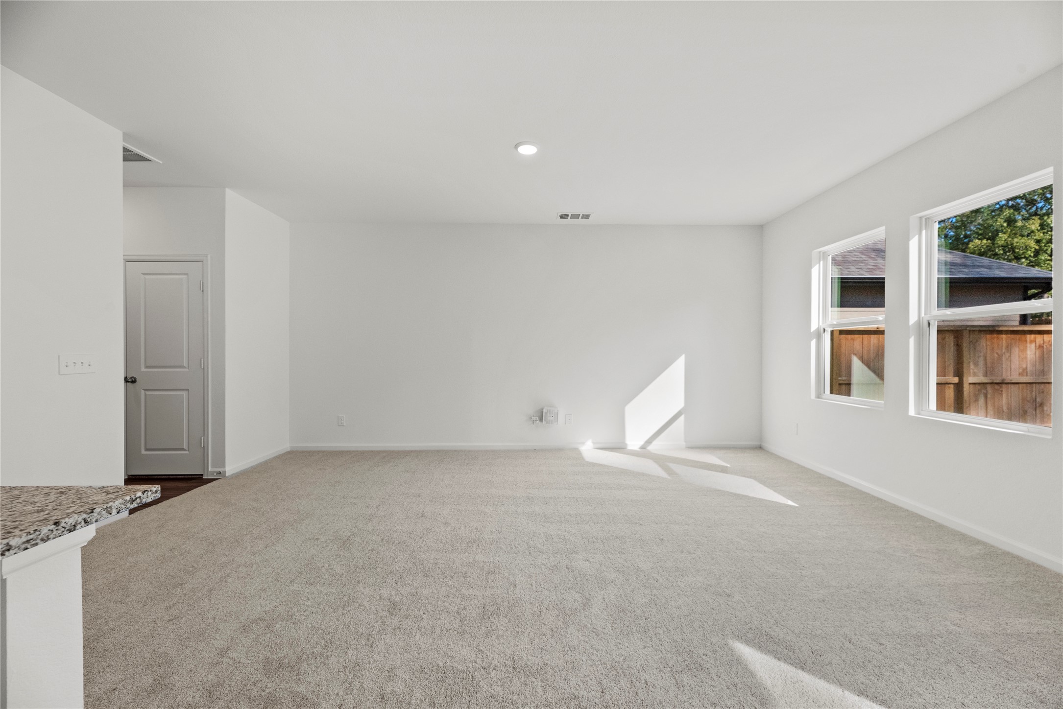 18829 Lucas Michael Way New Caney, TX 77357 - Photo 20 of 40 a view of an empty room with a window