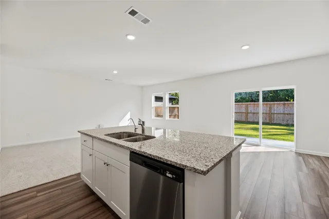 a kitchen with a sink and cabinets