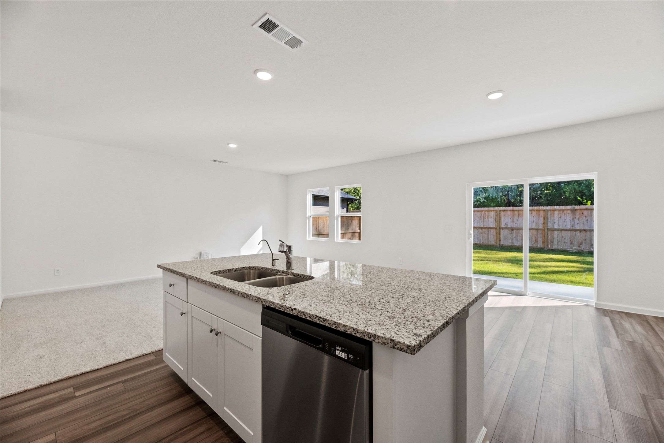 18829 Lucas Michael Way New Caney, TX 77357 - Photo 26 of 40 a kitchen with a sink and cabinets