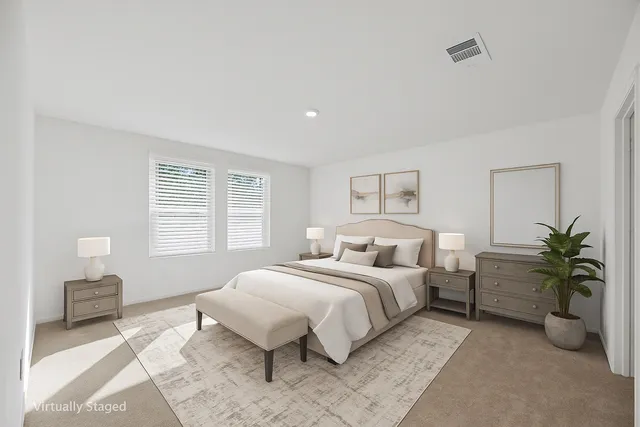 a bedroom with a bed and a couch